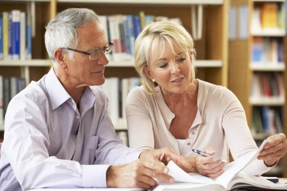 A Smart Financial advisor reviewing a retirement plan with clients.